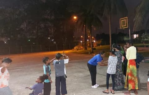 Children using binoculars during WISH astronomy outreach